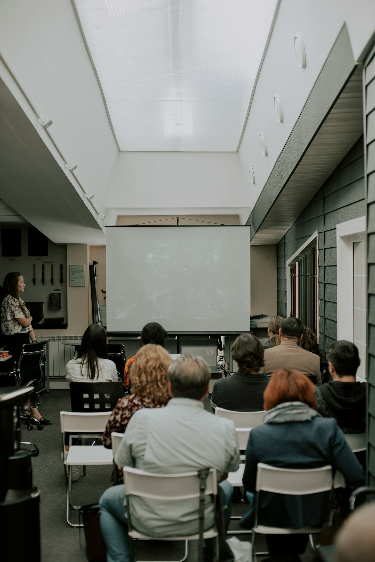 a group of people sitting in chairs in a room